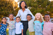 © Monkey Business - Portrait Of Female Primary Or Elementary School Teacher With Multi-Cultural Class Outdoors