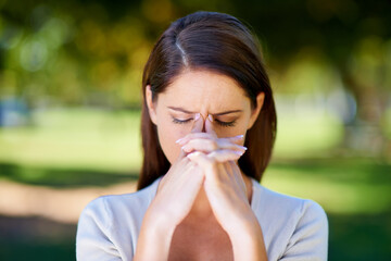 Woman, frown or mental health as stress, anxiety or headache in need of help, support or wellness. Upset, burnout or tired girl as praying for fatigue, brain fog or crisis to end in nature park