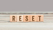 Word Reset on wood cubes