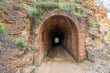 Old railway tunnel in the hiking route of the water mills along the Odiel river from Sotiel Coronada, in Huelva province, Andalusia, Spain