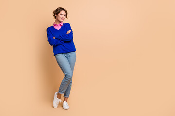 Sticker - Full size photo of attractive young woman folded hands confident posing wear trendy blue clothes isolated on beige color background