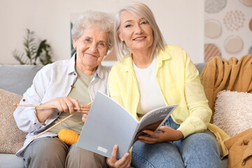 Sticker - Mature woman spending time with her senior mother at home