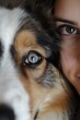extremely close up of female face with brown eyes and dog, cute young girl with pet, macro shot