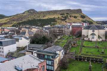 Wall Mural - Kirk of the Canongate, cemetery and Holyrood Park in Edinburgh city, Scotland, UK