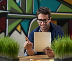 Fototapete - Smile, creative and man with tablet, reading and thinking for solution, online research or social media. Professional, digital app and designer at desk with choice, business plan or startup decision.