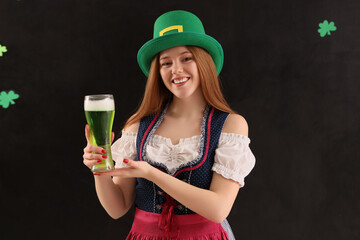 Poster - Young woman with beer on dark background. St. Patrick's Day celebration