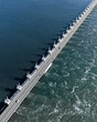 © AmazingAerialAgency - Aerial drone view of storm surge barrier Oosterscheldekering, bridge and water barrier, The Netherlands.