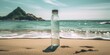 Closeup of a glass reusable water bottle on the seashore of a lonely beach