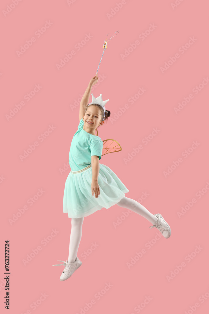 Cute little fairy with wand jumping on pink background