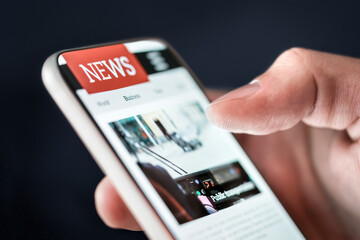 News in phone. Online newspaper article. Digital press publication. Reading latest headlines on digital mobile publication website or app with smartphone. Mockup media portal site. Information on web.