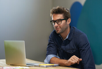 glasses, creative and man at laptop thinking for ideas, research and reading email in office. brains