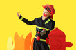 Cute little firefighter with radio transmitter and paper decor on yellow background