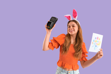 Sticker - Young woman in bunny ears with card and payment terminal on lilac background. Easter Sale