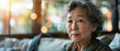 Portrait thinking and senior Asian woman in retirement home, reflection and remembering past life. Elderly, relax and contemplating future or memory, nostalgia and wellness in apartment with bokeh