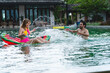 © chokniti - friendship lifestyle to happy fun in summer vacation holiday, young caucasian woman and man friend group in swimming pool water party, female person in swimwear bikini, outdoor enjoyment smiling girl