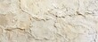 © The 2R Artificiality - A detailed close up of a wall with a beige marble texture, resembling a beautiful landscape painting. The intricate carvings on the marble create a stunning piece of art