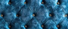 A Closeup Image Of A Tufted Couch In Electric Blue Color With Gold Buttons, Resembling The Pattern Of Petals Of A Terrestrial Plant In The Aqua Sky