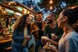 A group of friends happily standing at an outdoor food truck