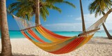 Fototapeta Mapy - Hammock on tropical beach. Vacation and travel concept.
