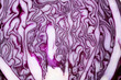 Closeup of a red cabbage with a vibrant purple and white pattern