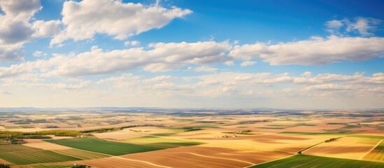 Aufkleber - Aerial view of expansive farmland with scattered fields