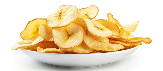 A bowl of crispy banana chips on a white surface