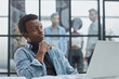 © Katsiaryna - smiling African American business man with executives working in background