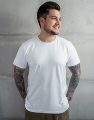 Wall Mural - Oversize white style t-shirt mockup photo with handsome man with tattoos and light concrete background