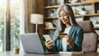 Serene middle-aged grey-haired Asian woman shopping online sitting with credit card and mobile phone at home, multiracial senior 50s female making order online, booking, transfering money 