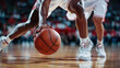 © DELstudio - Basketball player is holding basketball ball on a court, close up photo