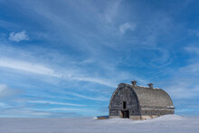 Abandoned Barn In The Winter Somewhere In Rural Saskatchewan. Beautiful Blue Skies Create A Stunning Composition; Saskatchewan, Canada