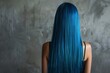 portrait of a beautiful long voluminous wavy blue hair on a girl, viewed from the back,Beautiful girl with hair coloring in ultra sky blue Stylish hairstyle done in a beauty salon. Fashion, cosmetics 