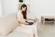 © SHOTPRIME STUDIO - Smiling Woman Freelancing on Laptop in Cozy Home Office, Enjoying Modern Technology