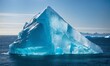 blue iceberg in the middle of the ocean