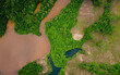 drone view of a river going through a lush forest