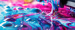 Close-up of colorful inks in water creating a psychedelic and fluid abstract pattern, symbolizing creativity and dynamic motion