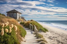Sandy Pathway Leading To A Charming Beach House By The Shore