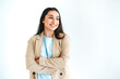 © Kateryna - Gorgeous confident indian or arabian brunette woman in elegant suit, standing on isolated white background with arms crossed, looking away, smiling happily
