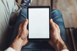 © MariiaDemchenko - Male hands holding tablet with blank white empty screen, concept of technology use in everyday life, mockup tablet