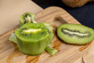 Wall Mural - green ripe kiwi fruit on the table