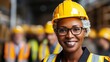 Middle aged black woman smirking on construction site in hard hat and work vest