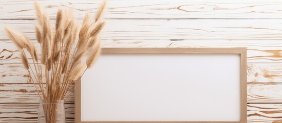 Poster - A wooden frame with greenery on a table