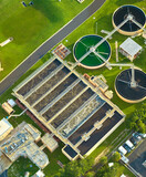 Fototapeta Mapy - Aerial view of modern water cleaning facility at urban wastewater treatment plant. Purification process of removing undesirable chemicals, suspended solids and gases from contaminated liquid