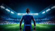 © Людмила Мазур - A soccer player stands on a field in front of a stadium full of people. The stadium is lit up, creating a bright and exciting atmosphere. The player is wearing a blue jersey and is ready to play