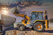 backhoe scooping earth dirt on construction site at sunset, new developments