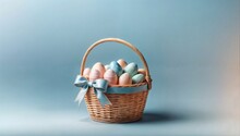 Woven Wicker Basket Adorned With A Soft Blue Ribbon Tied In A Bow On The Handle. The Basket Is Filled With A Collection Of Painted Easter Eggs In Gentle Pastel Shades Of Pink, Blue, And Green