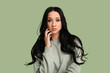 © Pixel-Shot - Beautiful young woman with dark wavy hair on green background