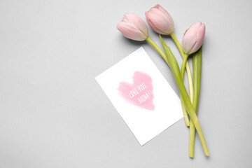 Canvas Print - Tulips and festive postcard with text LOVE YOU MOM on white background. Mother's Day celebration