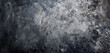 An image featuring a mottled background with an artistic blend of charcoal black and icy silver, giving the impression of a moonlit night