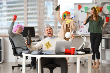 Sticker - Business man with his colleagues celebrating April Fools' Day at office party